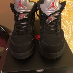 Air Jordan 5s metallic.